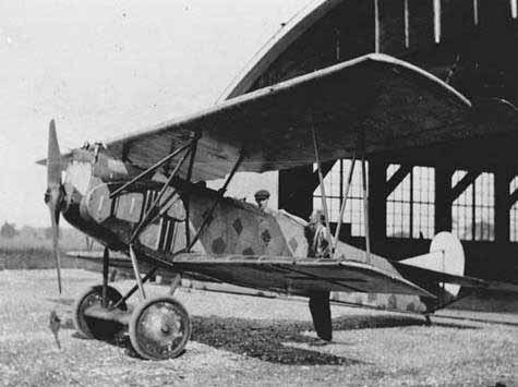 WW1 photograph of a Fokker D VII aircraft outside a hangar