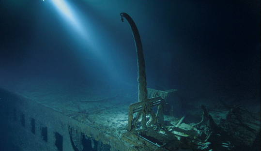 Underwater photograph of the Titanic wreck showing a single davit remaining